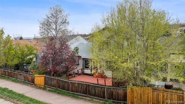 5849 Chokecherry Dr, Colorado Springs, CO 80919 - view of front facade featuring a fenced front yard and a deck