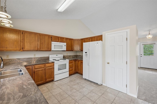 5849 Chokecherry Dr, Colorado Springs, CO 80919 - kitchen with white appliances, hanging light fixtures, brown cabinetry, and a sink
