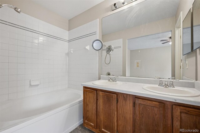 5849 Chokecherry Dr, Colorado Springs, CO 80919 - bathroom featuring double vanity, a ceiling fan, a sink, and shower / bathing tub combination