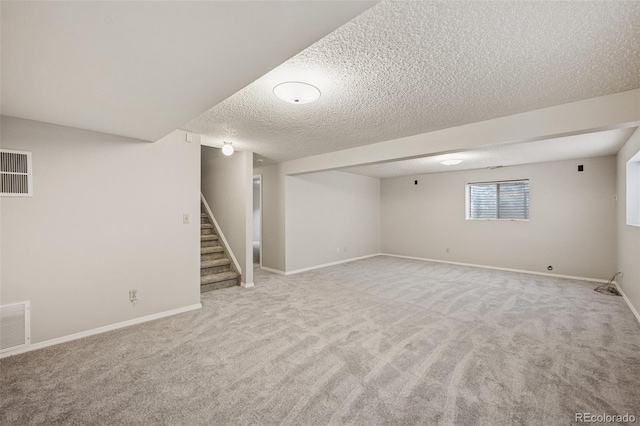 5849 Chokecherry Dr, Colorado Springs, CO 80919 - basement featuring visible vents, carpet flooring, and a textured ceiling
