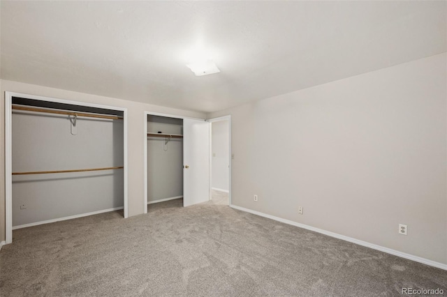 5849 Chokecherry Dr, Colorado Springs, CO 80919 - unfurnished bedroom featuring two closets, baseboards, and carpet floors