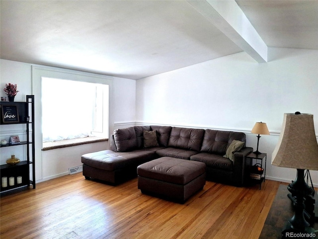 2580 Valley View Dr, Denver, CO 80221 - living area with wood finished floors, beam ceiling, and baseboards