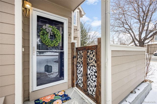 view of snow covered property entrance