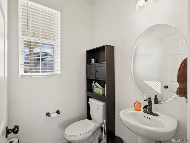 bathroom with sink and toilet