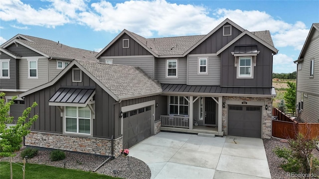 craftsman-style home featuring covered porch and a garage