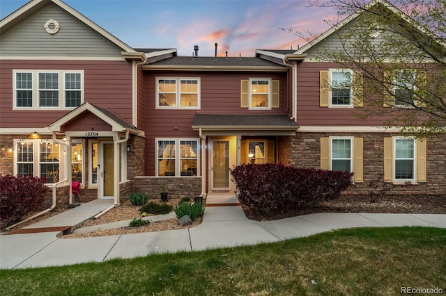 townhome / multi-family property with stone siding