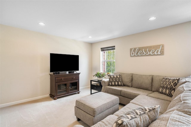 living area with recessed lighting, baseboards, and light colored carpet