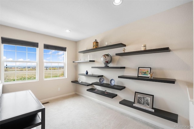 unfurnished office with baseboards, carpet, and recessed lighting