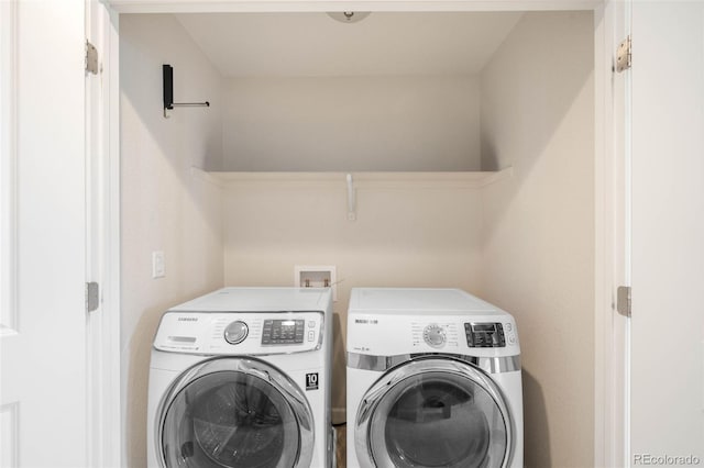 laundry area featuring independent washer and dryer and laundry area
