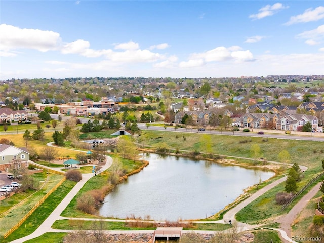 birds eye view of property with a residential view and a water view