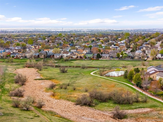 aerial view featuring a residential view and a water view