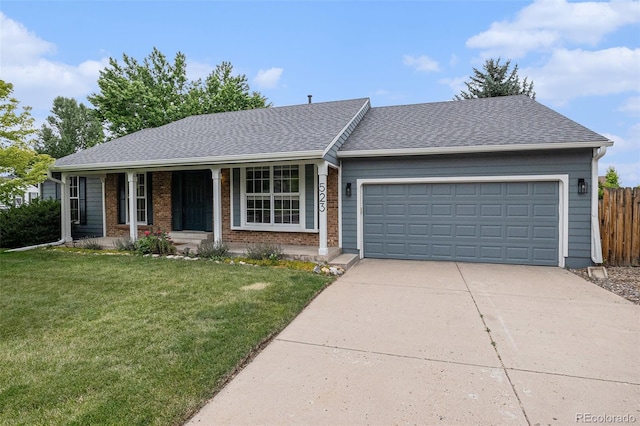523 E Long Ct, Littleton, CO 80122 - ranch-style home with driveway, an attached garage, covered porch, roof with shingles, and brick siding