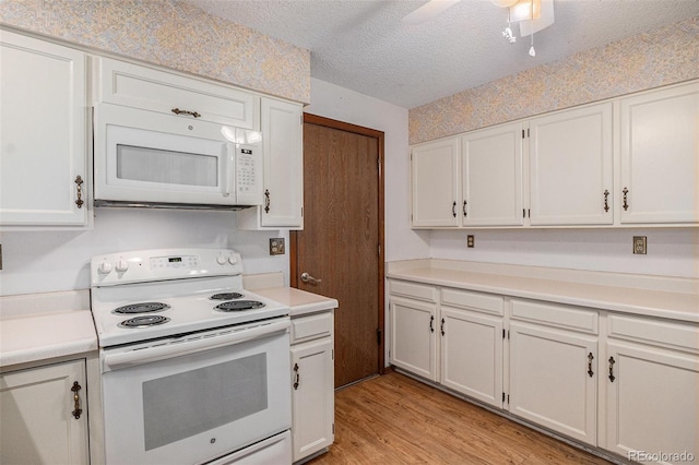 523 E Long Ct, Littleton, CO 80122 - kitchen with white appliances, light countertops, light wood finished floors, and a textured ceiling