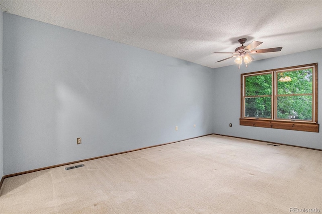 523 E Long Ct, Littleton, CO 80122 - spare room with light colored carpet, ceiling fan, and a textured ceiling