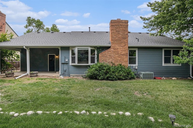 523 E Long Ct, Littleton, CO 80122 - back of house with a chimney, a patio area, and a shingled roof