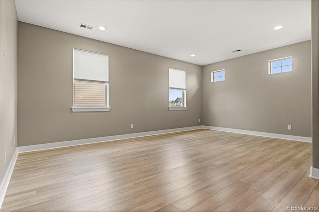 6129 E 143rd Ave, Thornton, CO 80602 - spare room featuring light wood-type flooring and recessed lighting