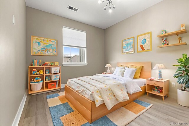 6129 E 143rd Ave, Thornton, CO 80602 - bedroom with wood finished floors and baseboards