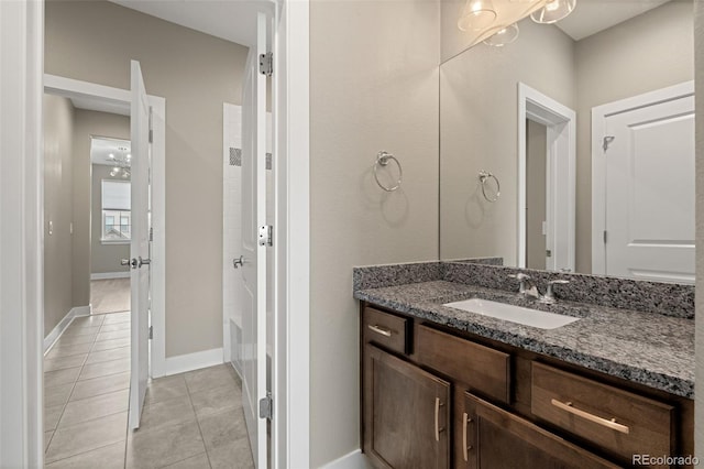 6129 E 143rd Ave, Thornton, CO 80602 - full bath featuring vanity, tile patterned flooring, and a bath