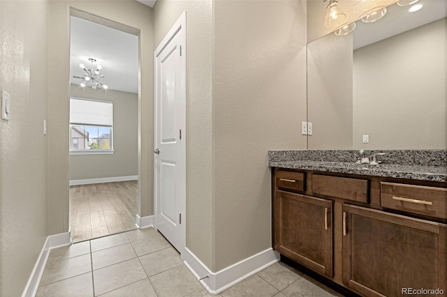 6129 E 143rd Ave, Thornton, CO 80602 - bathroom with vanity and tile patterned floors