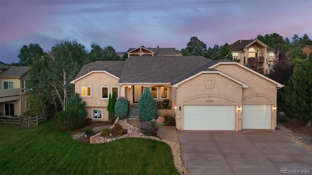 view of front of home with a lawn