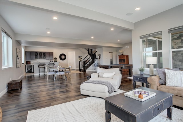 living room with dark hardwood / wood-style floors and beverage cooler