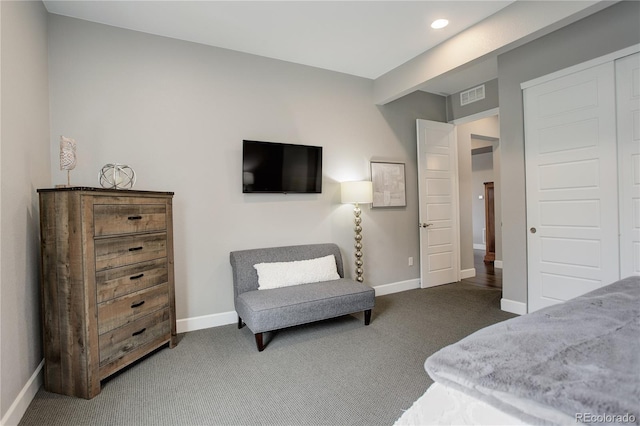 carpeted bedroom with a closet