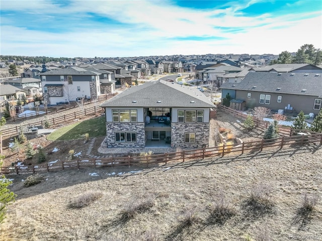 rear view of property with a balcony