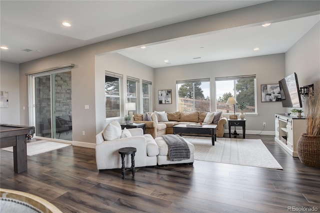 living room featuring dark hardwood / wood-style flooring and pool table