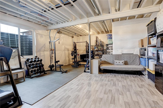 workout area with hardwood / wood-style floors