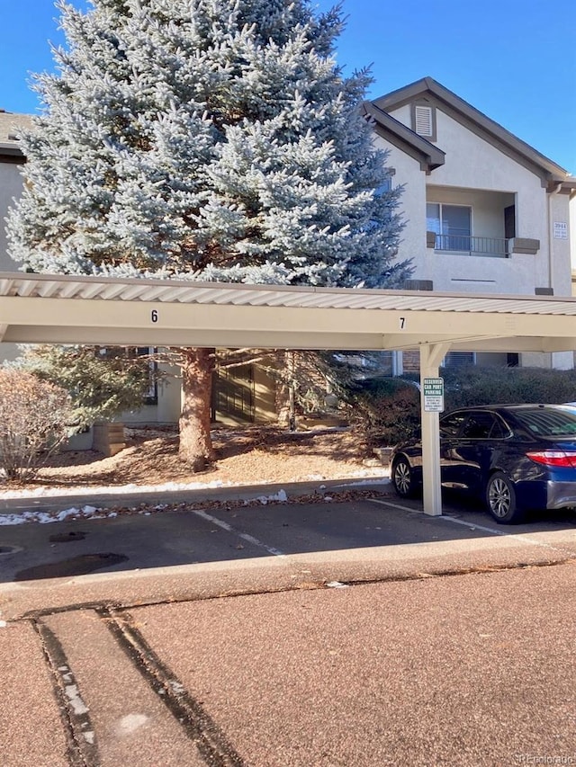 exterior space with a carport