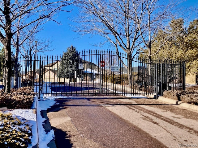 view of snow covered gate