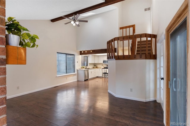 unfurnished living room featuring visible vents, baseboards, dark wood-style floors, and ceiling fan