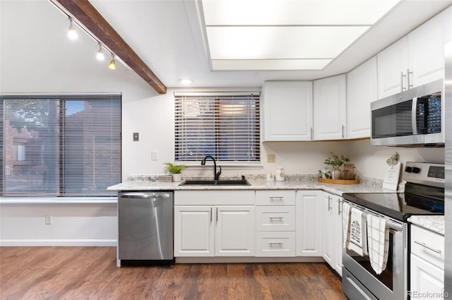 kitchen featuring a sink, dark wood-style floors, white cabinetry, and stainless steel appliances