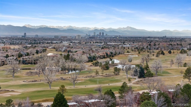 drone / aerial view with a mountain view and view of golf course