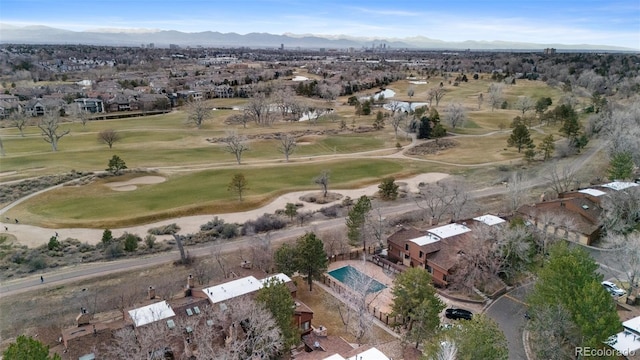 aerial view with a mountain view and view of golf course