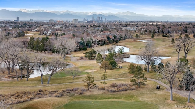 birds eye view of property featuring a water and mountain view