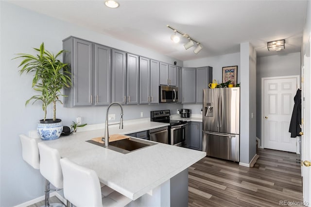 4797 Flower St, Wheat Ridge, CO 80033 - kitchen with stainless steel appliances, a sink, and gray cabinetry