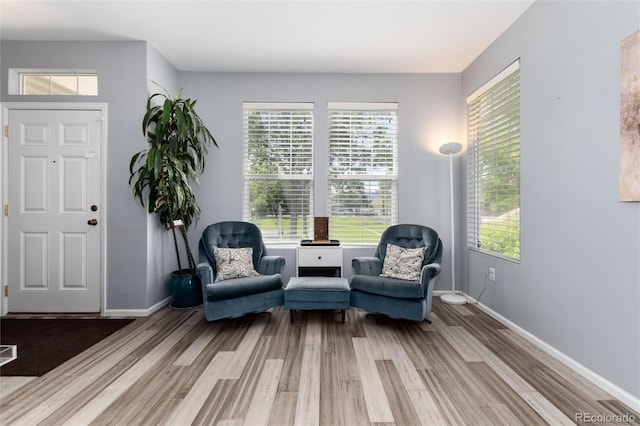 4797 Flower St, Wheat Ridge, CO 80033 - sitting room featuring light wood-style flooring, healthy amount of natural light, and baseboards
