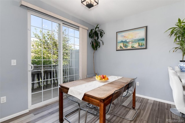4797 Flower St, Wheat Ridge, CO 80033 - dining space featuring baseboards and wood finished floors