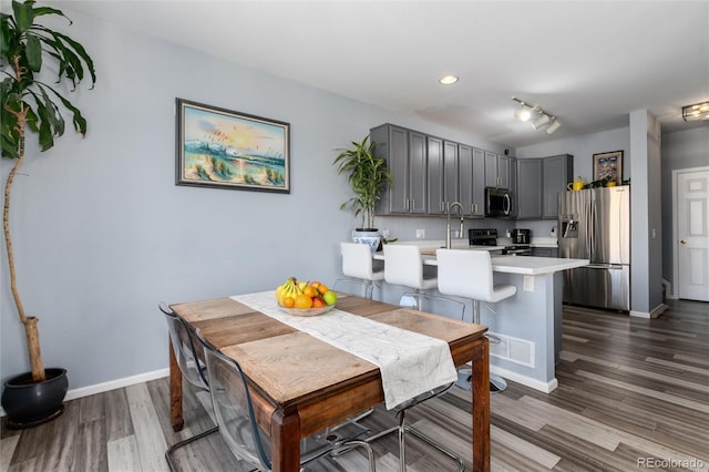4797 Flower St, Wheat Ridge, CO 80033 - dining area with dark wood-type flooring, baseboards, and recessed lighting