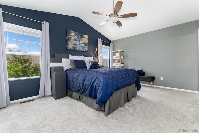 4797 Flower St, Wheat Ridge, CO 80033 - carpeted bedroom featuring lofted ceiling, multiple windows, baseboards, and ceiling fan