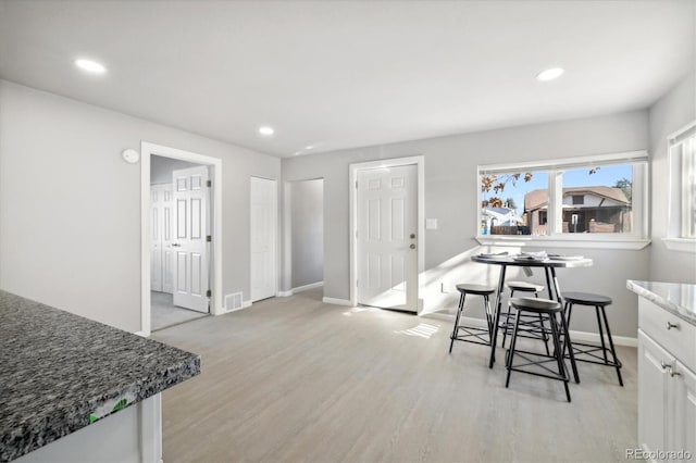 dining area with light hardwood / wood-style floors