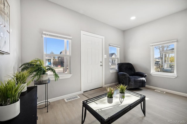 sitting room featuring light hardwood / wood-style flooring