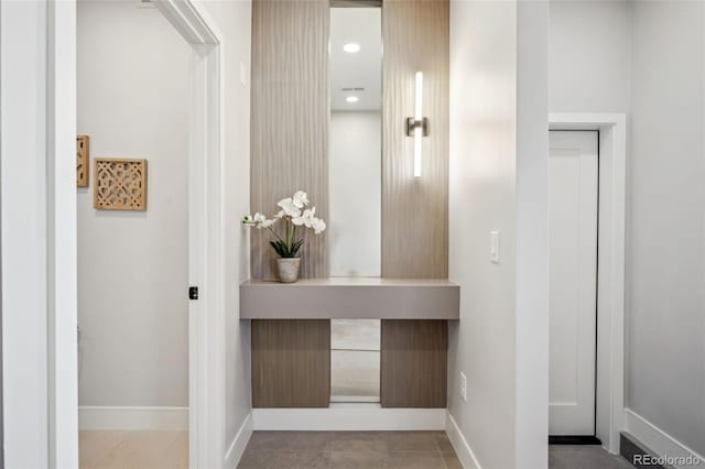 corridor featuring baseboards