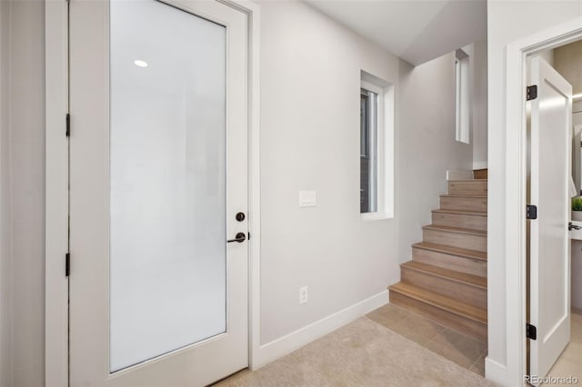 stairs featuring baseboards