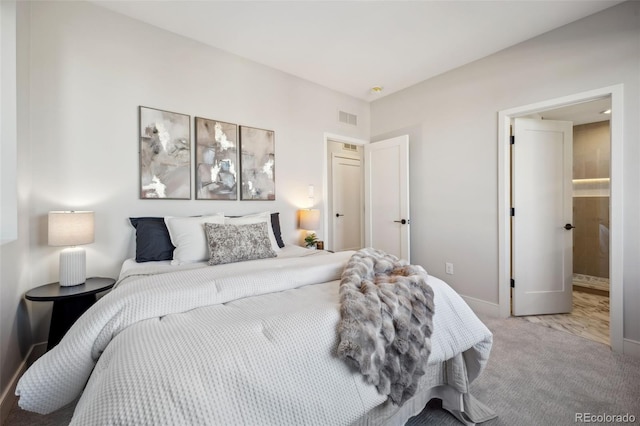 bedroom featuring visible vents, baseboards, and carpet floors