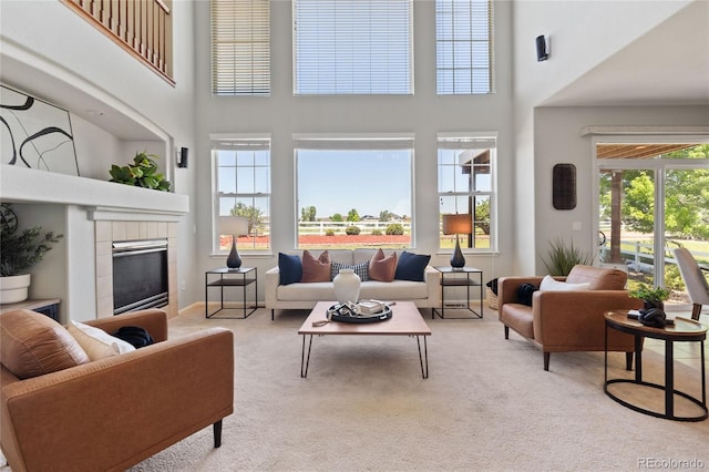 1461 S Grand Baker St, Aurora, CO 80018 - living room with a towering ceiling, light carpet, and a tile fireplace