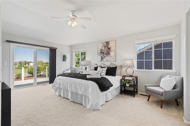 1461 S Grand Baker St, Aurora, CO 80018 - bedroom featuring access to exterior, light carpet, and ceiling fan