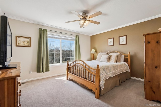 carpeted bedroom featuring baseboards, ornamental molding, and ceiling fan