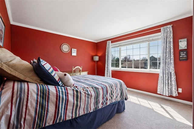 carpeted bedroom featuring ornamental molding and baseboards